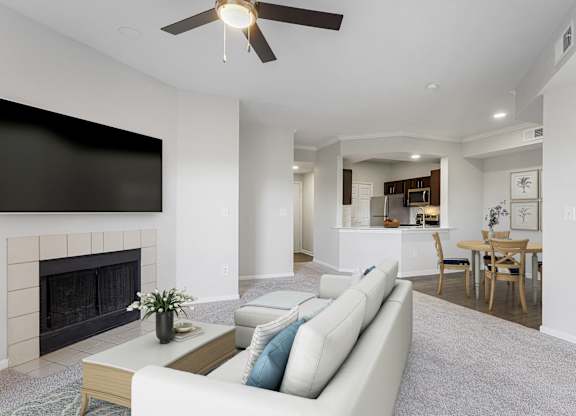 a living room with a couch and a fireplace at The Legends at Eagle Mountain Lake, Fort Worth, Texas
