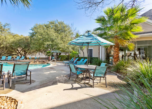 Umbrella Shaded Chairs By Pool  at Stone Oak @ Parmer, Austin, Texas
