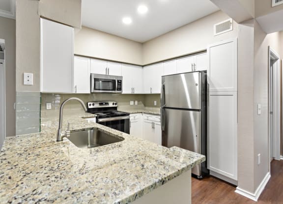 Kitchen With Custom Cabinetry  at Stone Oak @ Parmer, Austin, TX
