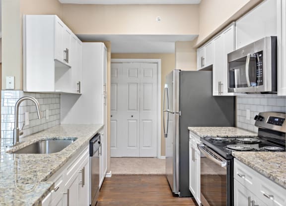 Kitchen With Custom Cabinetry  at Stone Oak @ Parmer, Austin, Texas