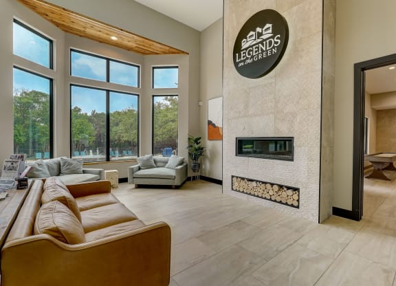 the living room has a fireplace and a large window