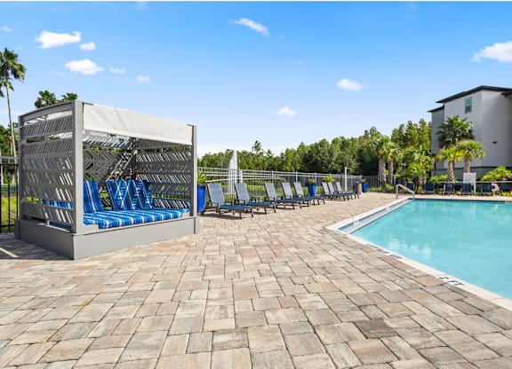Pool With Lounge Chairs at The Oasis at Highwoods Preserve, Florida, 33647
