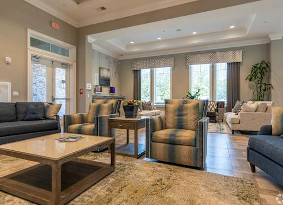 Living Room with Coffee Table at The Oasis at Town Center Apartments, Jacksonville, FL, 32246