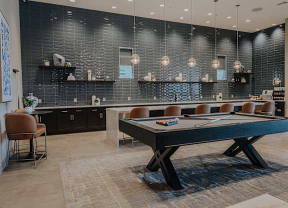 Clubhouse with kitchen area and pool table at Level 25 at The Curve by Picerne, Las Vegas, 89148