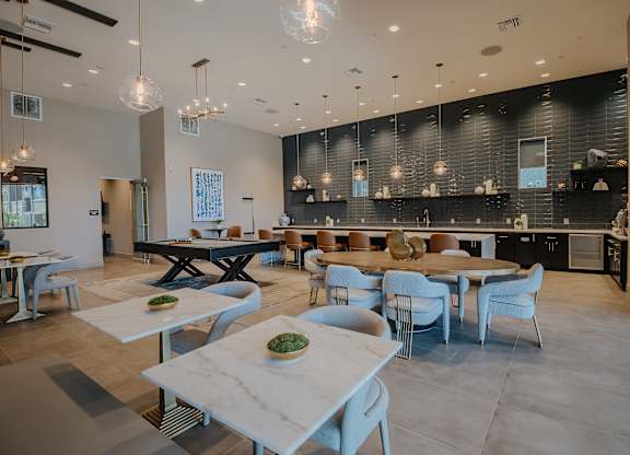 Large modern clubhouse with cafe seating at Level 25 at The Curve by Picerne, Las Vegas