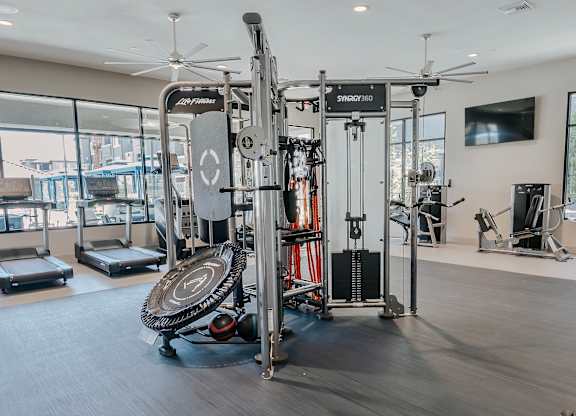 Gym with a SYRRO 250 weight machine at Level 25 at The Curve by Picerne, Las Vegas, NV