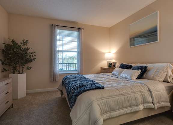 Bedroom with a Large Bed at The Oasis at Town Center Apartments, Florida