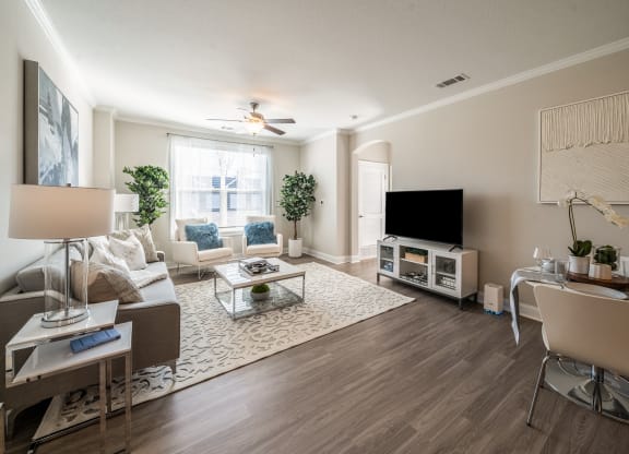 a living room with a couch and a tv  at The Oasis at Plymouth, Plymouth, MA
