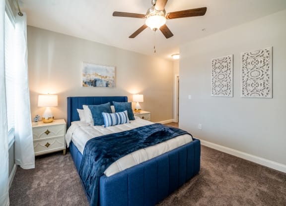 a bedroom with a bed and a ceiling fan at The Oasis at Plymouth, Plymouth, MA, 02360