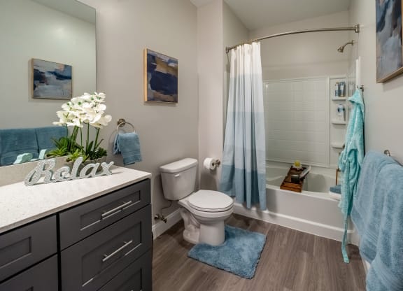 a bathroom with a shower and a toilet and a sink at The Oasis at Plymouth, Plymouth, MA