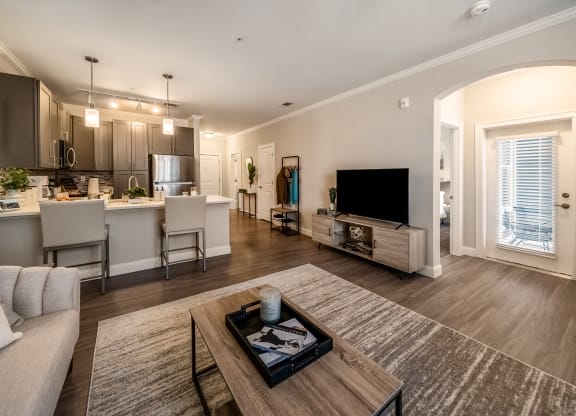 a living room and kitchen with a couch and a table at The Oasis at Plymouth, Massachusetts