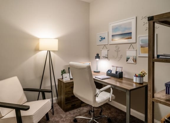 a home office with a desk and chair and a lamp at The Oasis at Plymouth, Massachusetts