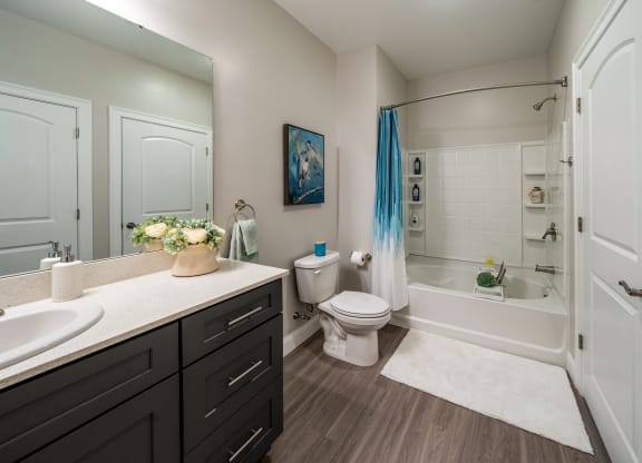 a bathroom with a toilet and a shower and a sink  at The Oasis at Plymouth, Plymouth, MA