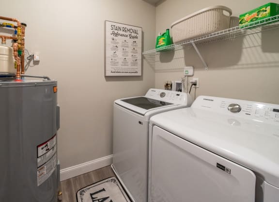 the laundry room has a washer and dryer and a refrigerator at The Oasis at Plymouth, Plymouth, MA, 02360