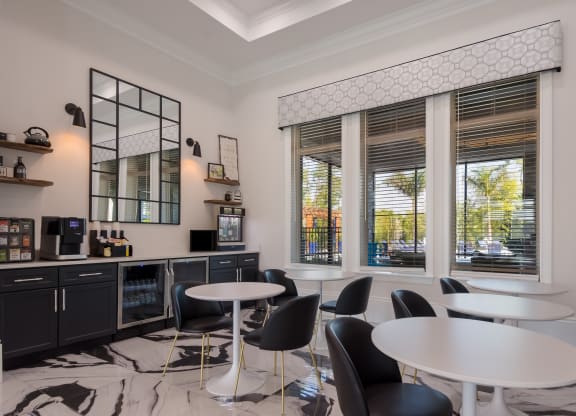 a room filled with furniture and a large window  at The Oasis at Manatee River, Bradenton, FL, 34211