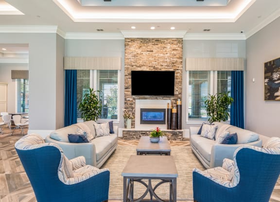Clubhouse interior with sofa at The Oasis at Crosstown, Florida