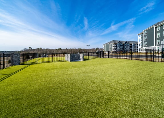 a large grassy area with a soccer goal in the middle of it at The Oasis at Plymouth, Plymouth, MA