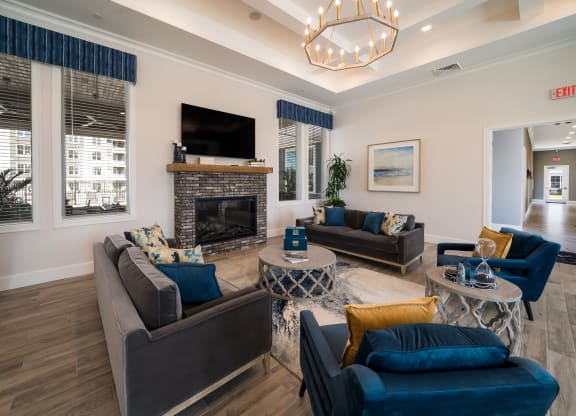 a living room with couches and a fireplace at The Oasis at Plymouth, Plymouth, Massachusetts