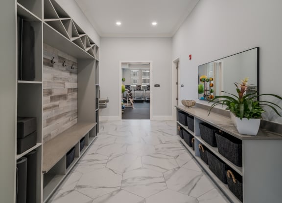the living room has a marble floor and a large counter with a plant at The Oasis at Plymouth, Massachusetts