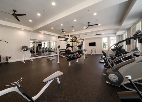 a gym with treadmills and other exercise equipment in a home at The Oasis at Plymouth, Plymouth, MA