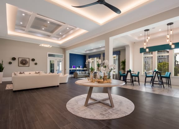 a living room filled with furniture and a large window  at The Oasis at Manatee River, Bradenton, FL