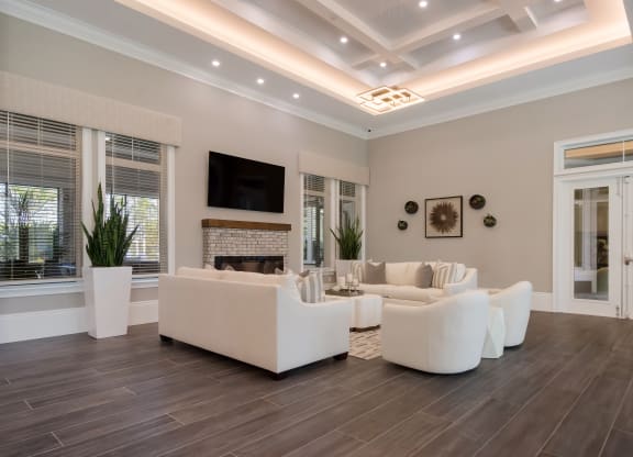 a living room with a coffered ceiling and hardwood flooring  at The Oasis at Manatee River, Bradenton, FL, 34211