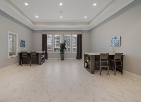 a dining room with a table and chairs and a window at The Oasis at Plymouth, Plymouth