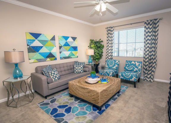 a living room with couches and a coffee table at Loreto & Palacio Apartments, Las Vegas, NV 89149