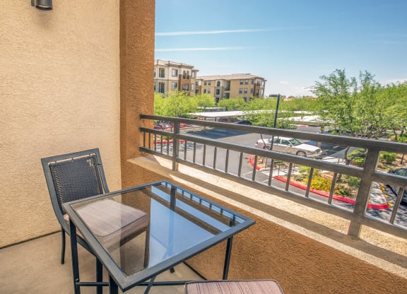 a balcony or terrace with a table and two chairs at Loreto & Palacio Apartments, Nevada