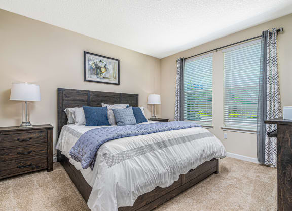 Bedroom with cozy bed at The Oasis at Crosstown, Orlando, Florida