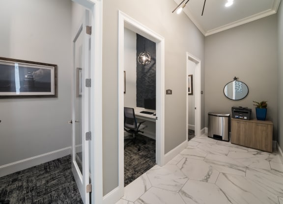 a corridor with a desk and a mirror in a home office  at The Oasis at Plymouth, Massachusetts