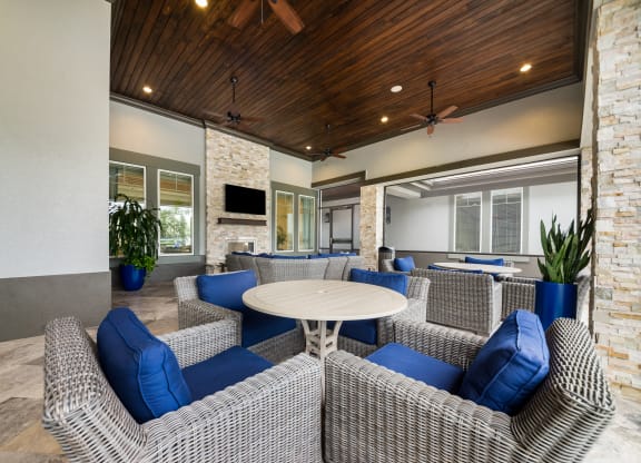 the preserve at ballantyne commons clubhouse with couches and tables at The Oasis at Highwoods Preserve, Florida