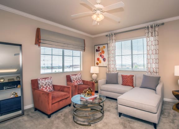 a living room with couches and chairs and a coffee table at Loreto & Palacio Apartments, Las Vegas, 89149