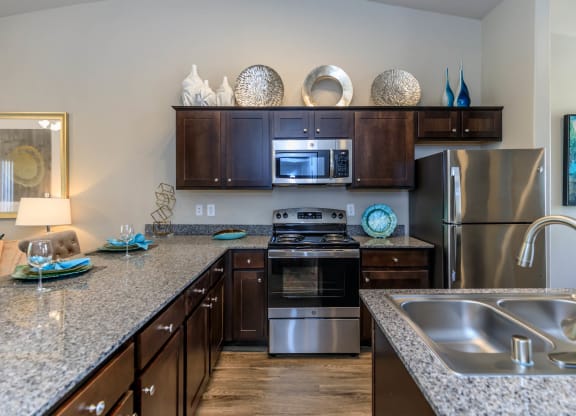 Kitchen wide view with cabinets at The Cantera by Picerne, Nevada