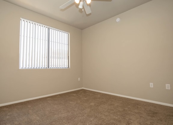 Unfurnished room with wooden floor and ceiling fan at The Cantera by Picerne, Las Vegas, Nevada