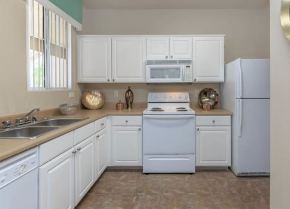 Kitchen area with cabinets at The Covington by Picerne, Nevada, 89139