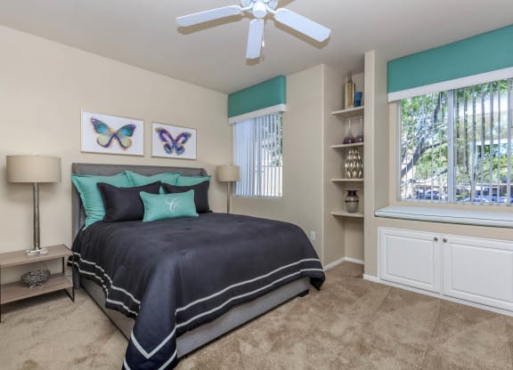 Bed with pillows in bedroom at The Covington by Picerne, Nevada