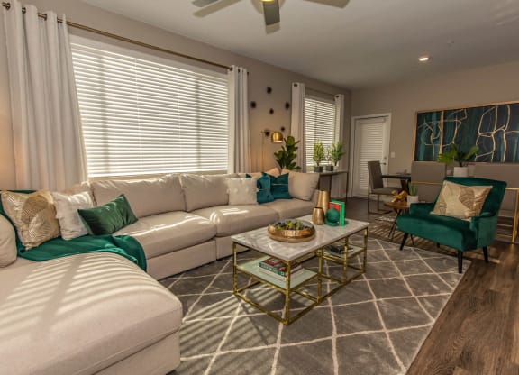Living room with couch and cushions at Level 25 at Cactus by Picerne, Las Vegas