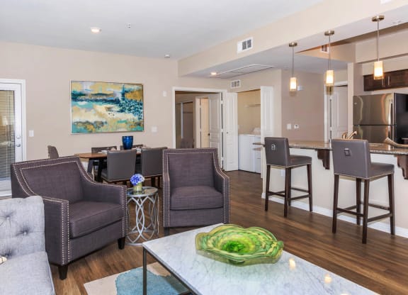 Breakfast bar in kitchen near living at Level 25 at Durango by Picerne, Las Vegas, NV