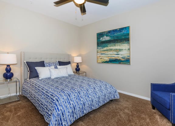 Bed and lamps with frames at Level 25 at Durango by Picerne, Las Vegas, NV