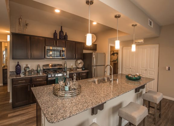 Kitchen with cabinets and appliances at Level 25 at Oquendo by Picerne, Las Vegas