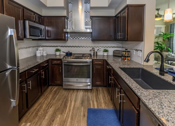 Kitchen with wooden cabinets1 at Level 25 at Sunset by Picerne, Nevada, 89113