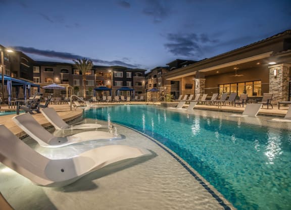 Pool view at night1 with buildingat Level 25 at Sunset by Picerne, Las Vegas, Nevada