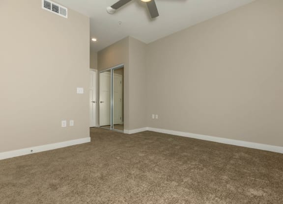 Wooden flooring and ceiling fan and light at Level 25 at Sunset by Picerne, Las Vegas