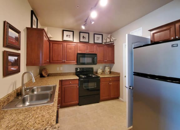 Kitchen Bar With Granite Counter Top at The Paramount by Picerne, Las Vegas, Nevada