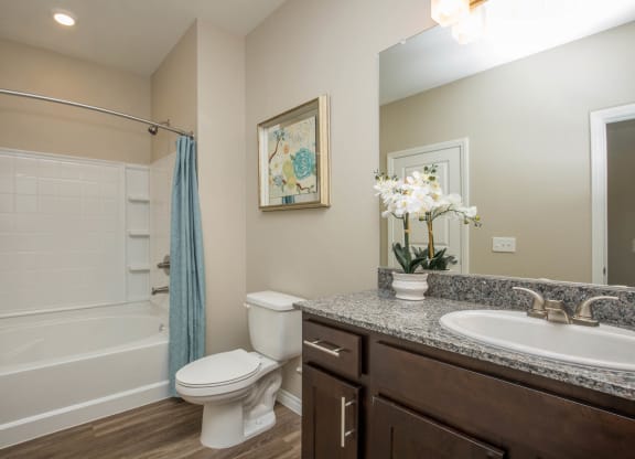 Renovated Bathrooms With Quartz Counters at The Passage Apartments by Picerne, Henderson