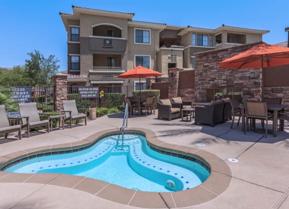 Swimming Pool Area With Shaded Chairs at The Presidio by Picerne, N Las Vegas, NV, 89084