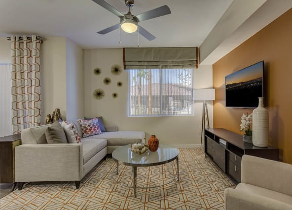 Living with couch and center table , ceiling fan and light at The View at Horizon Ridge, Nevada