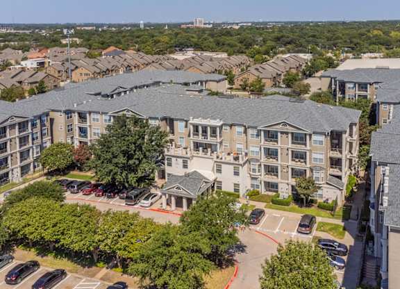 An aerial view of Encore at Buckingham apartments entry showcasing apartment patios and balconies, in Richardson, TX