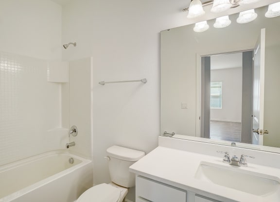 Bathroom in the Elm floor plan with white counters at Beacon at Clinton Corners in Dade City, FL